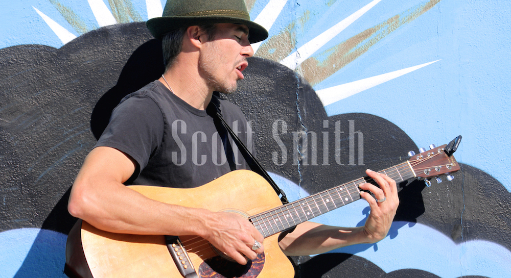 Scott Playing Guitar - Text Over - Blue Wall